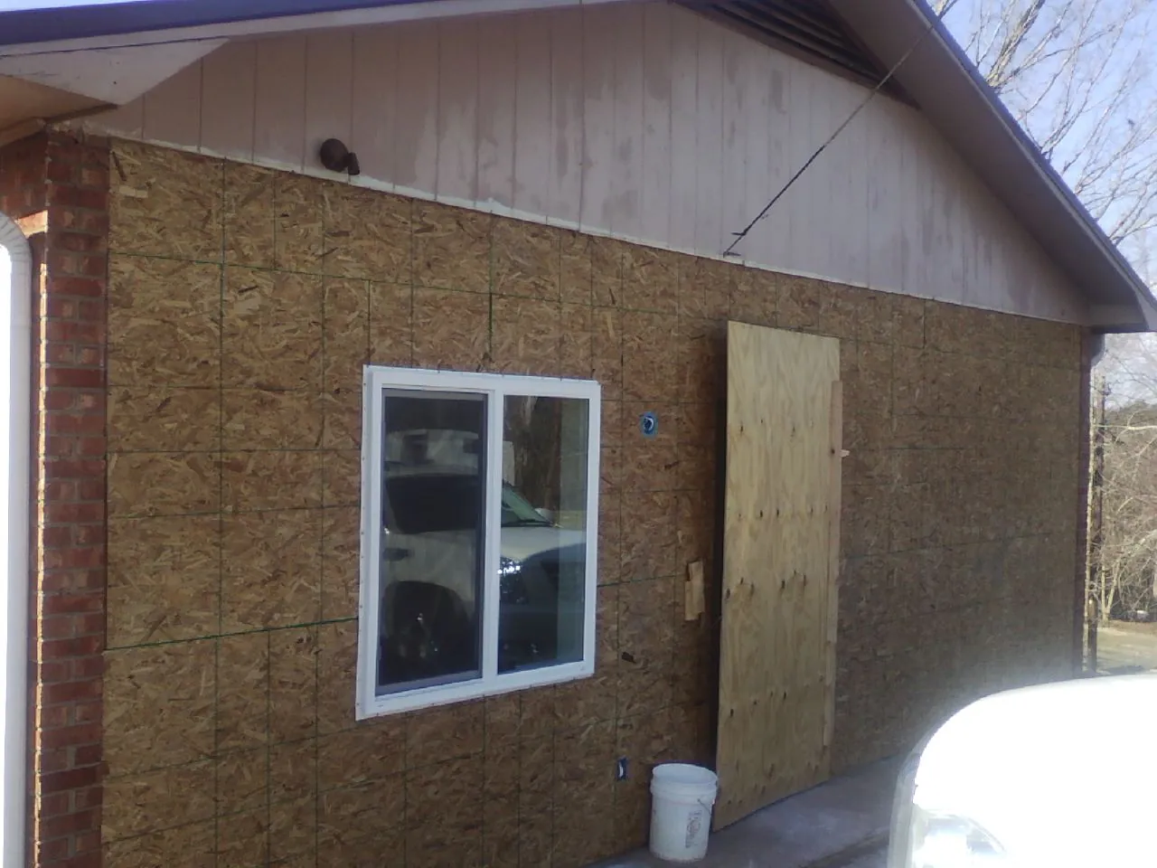 OSB sheathing on a garage addition wall before siding in Cookeville